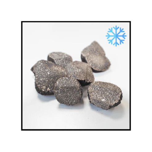 Pieces of frozen black truffles